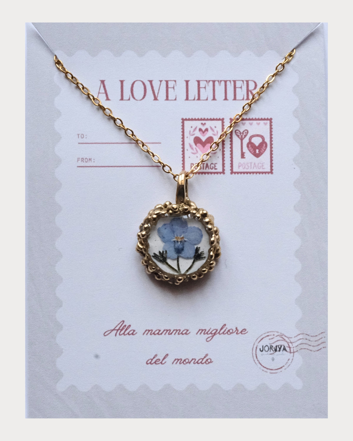 Collana con fiore di non ti scordar di me su base bianca