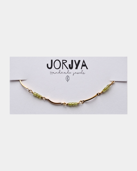 Bracciale con maglie ondulate e pietre di peridoto