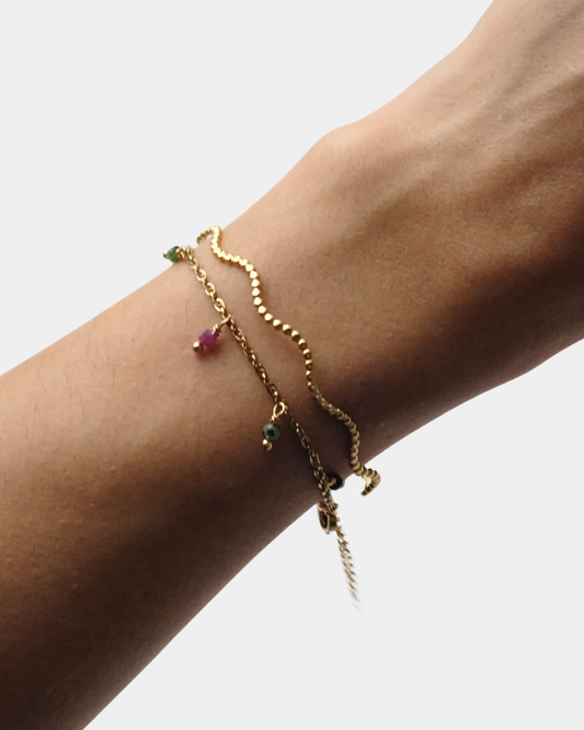 Set di due bracciali: uno rigido ondulato e uno con pietre di tormalina